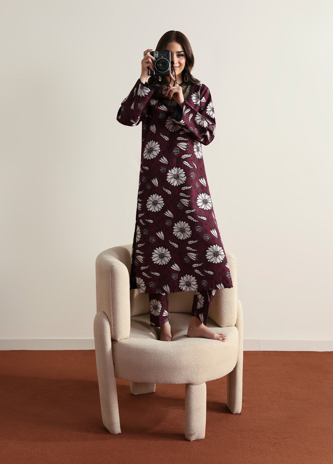 Model wearing Evra from Gulaal in a deep maroon printed co-ord set with bold white floral patterns, perfect for Pakistani luxury pret in the UK.