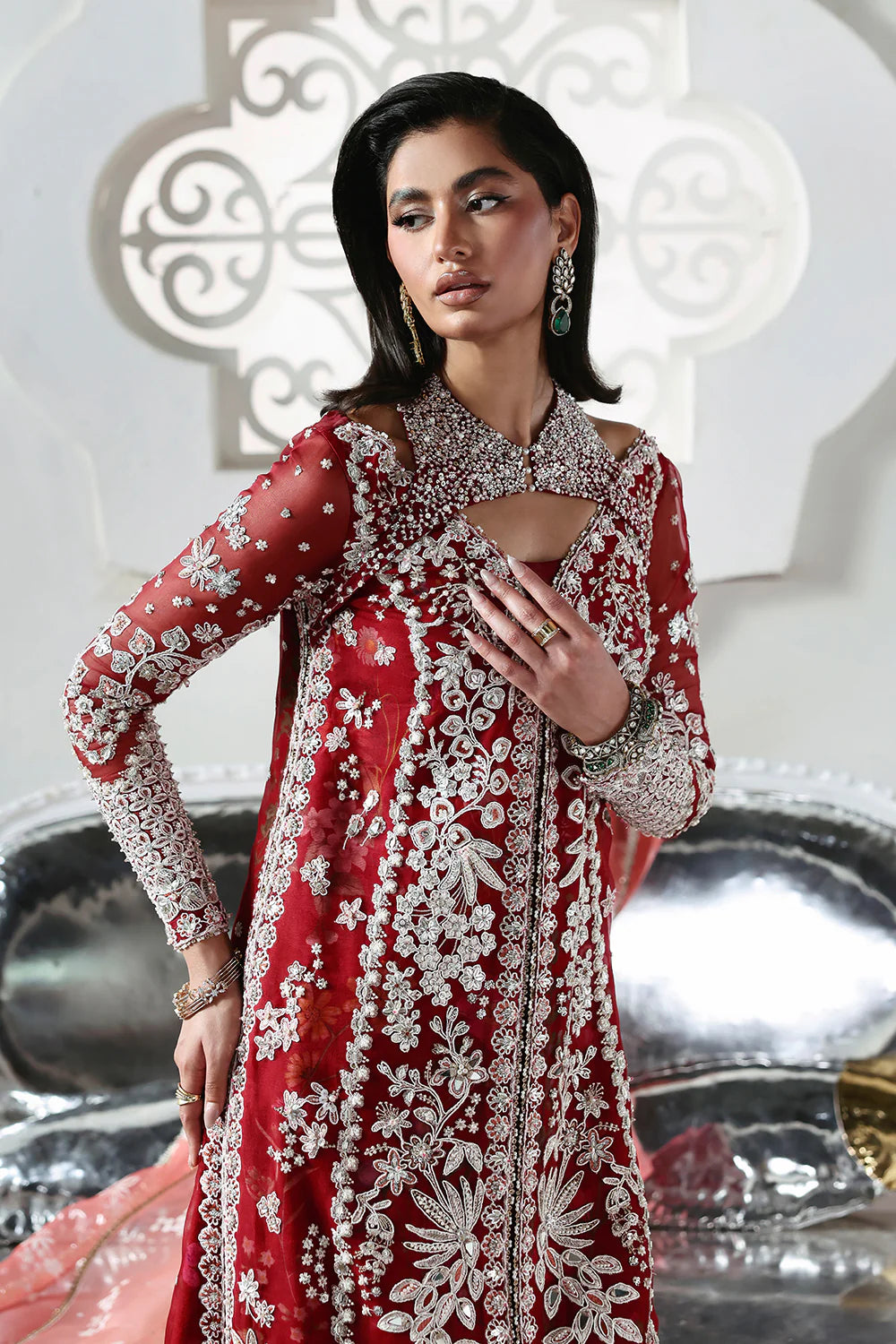 Model wearing Solara by Soraya in deep red with heavy white embroidery and peach dupatta – Pakistani luxury pret, shop online in UK.
