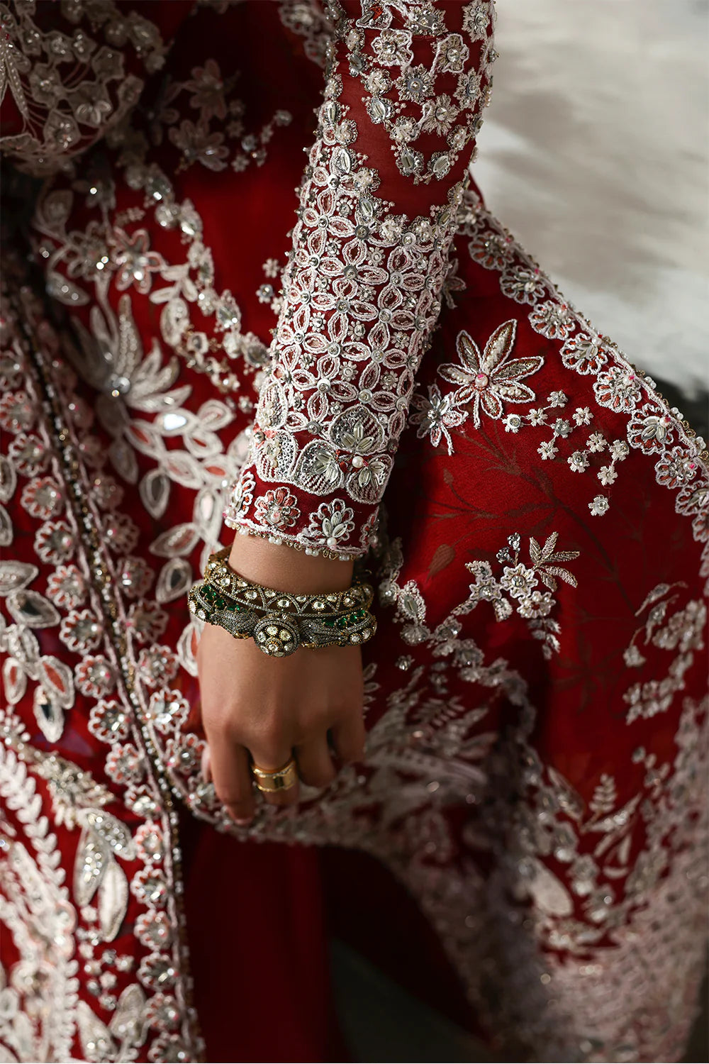 Model wearing Solara by Soraya in deep red with heavy white embroidery and peach dupatta – Pakistani luxury pret, shop online in UK.
