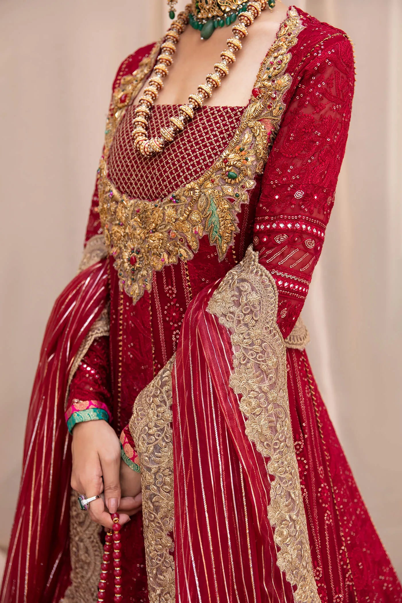 Model wearing Symphony'sSCARLET ELEGANCE, an equisite mold by Musferah Saad UK, Pakistani Clothes UK.