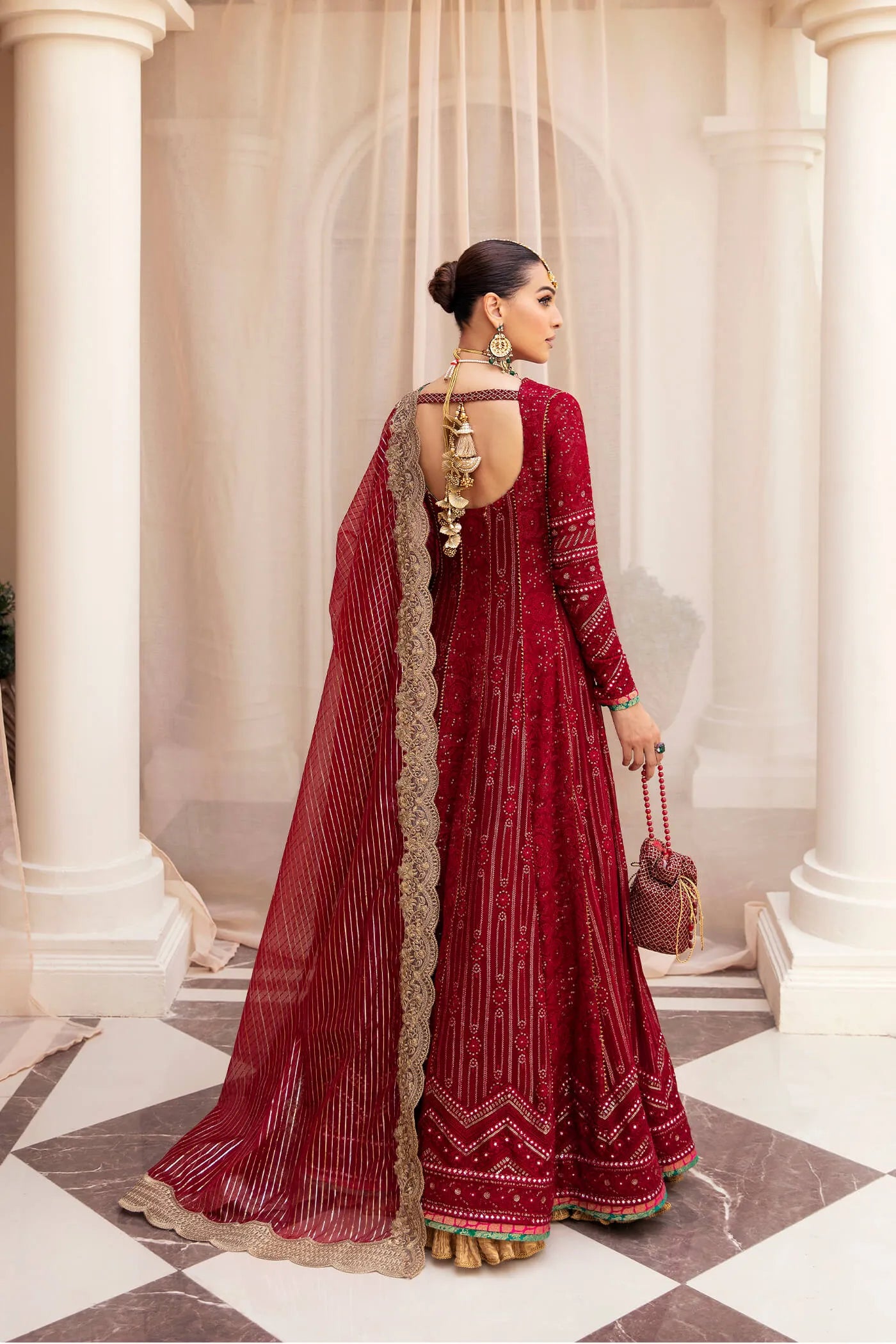 Model wearing Symphony'sSCARLET ELEGANCE, an equisite mold by Musferah Saad UK, Pakistani Clothes UK.