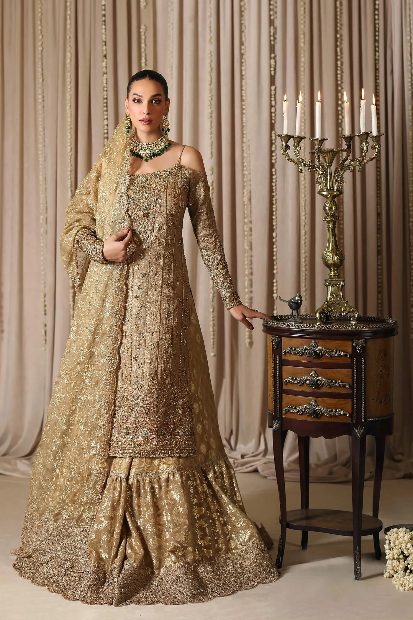 Model wearing a gold CELESTIAL CROWN dress from Musferah Saad's The Modern Maharani '23 collection, showcasing Pakistani clothes online in the UK.