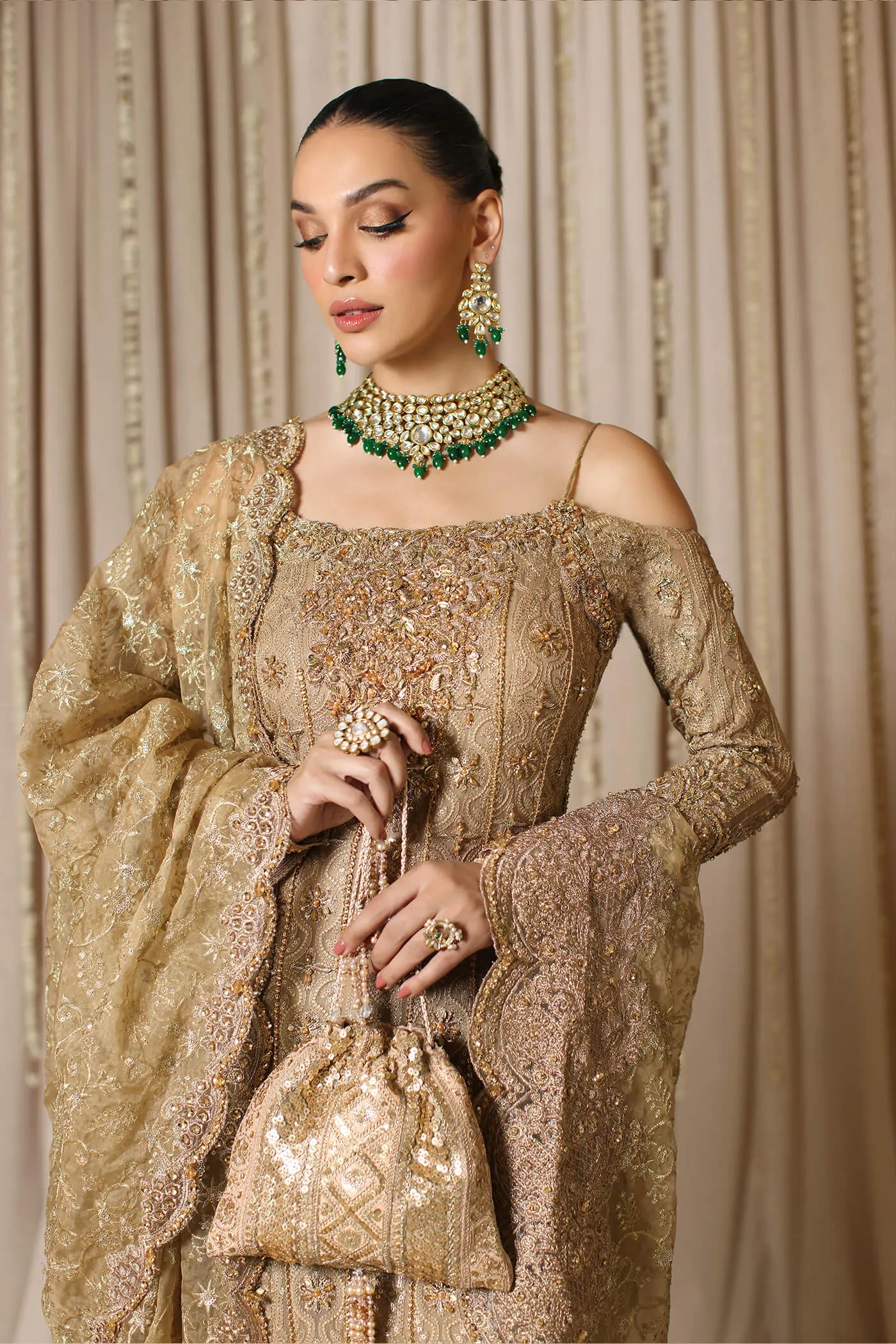 Model wearing a gold CELESTIAL CROWN dress from Musferah Saad's The Modern Maharani '23 collection, showcasing Pakistani clothes online in the UK.