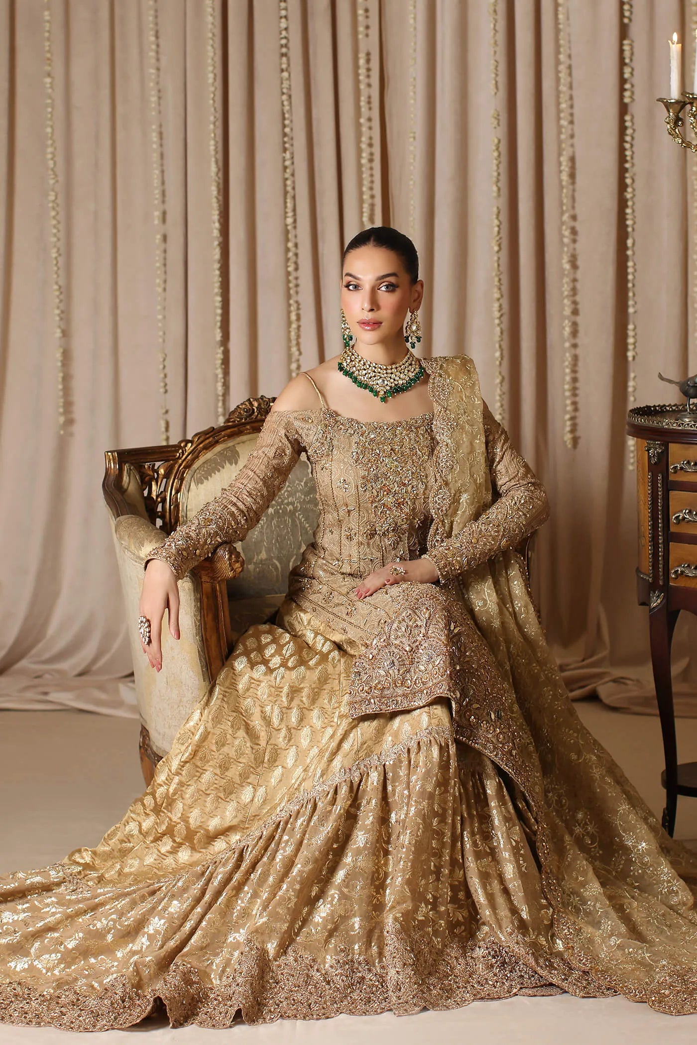 Model wearing a gold CELESTIAL CROWN dress from Musferah Saad's The Modern Maharani '23 collection, showcasing Pakistani clothes online in the UK.