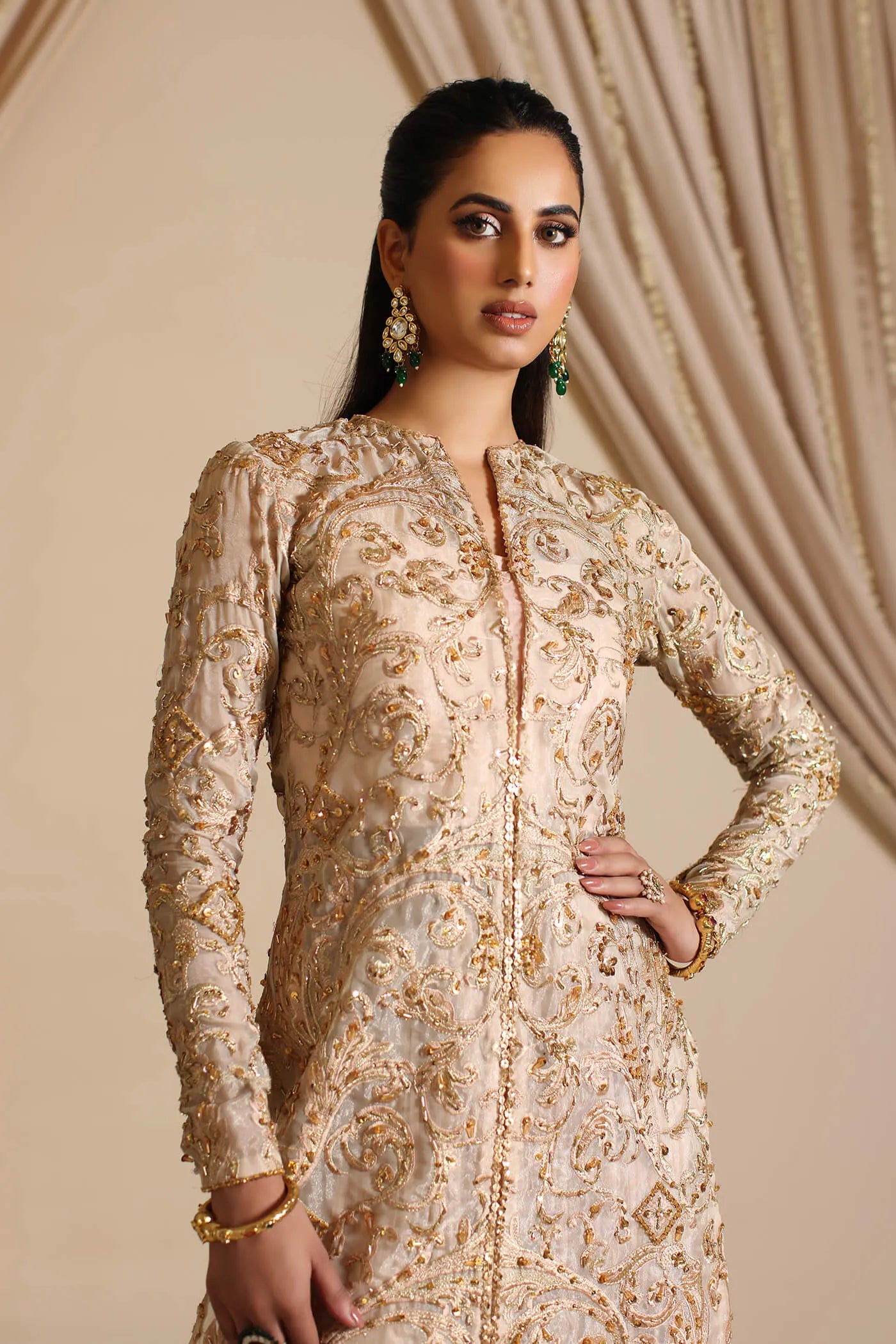 Model wearing Musferah Saad Golden Mirage, an elegant Pakistani bridal dress in UK.