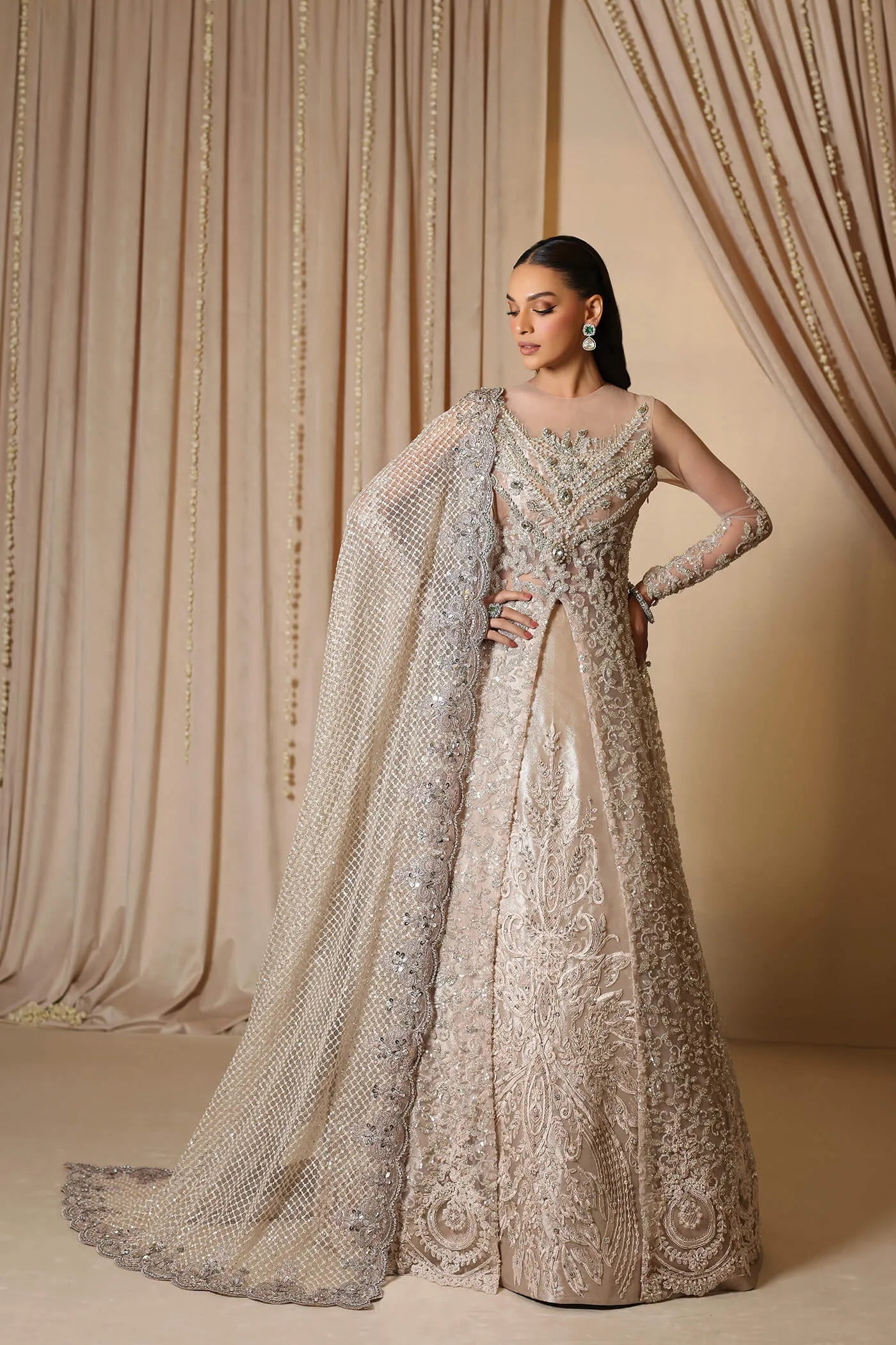 Model wearing a rose gold ROYAL ROSE dress from Musferah Saad's The Modern Maharani '23 collection, highlighting Pakistani clothes online in the UK.