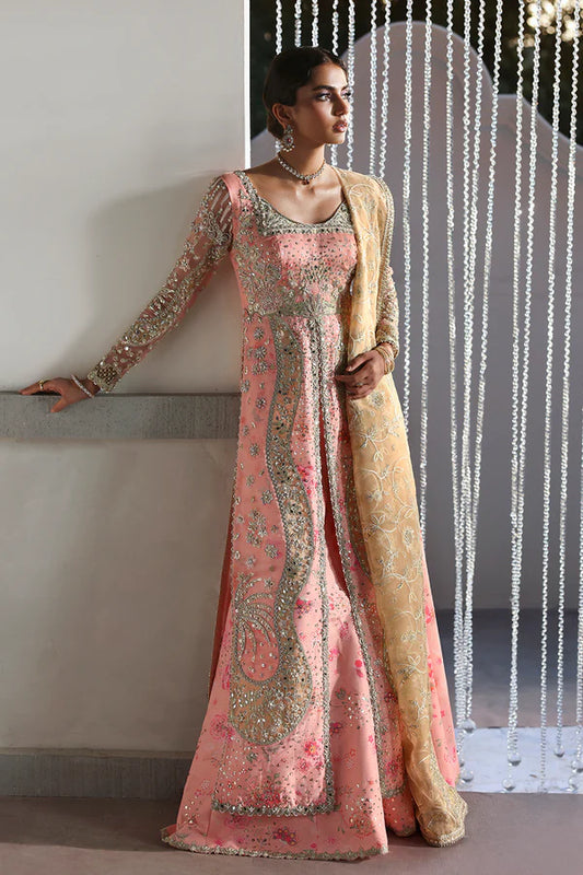 Model wearing Velora by Soraya in soft peach and gold embroidered gown – Pakistani luxury pret for weddings, shop Pakistani clothes online in UK.
