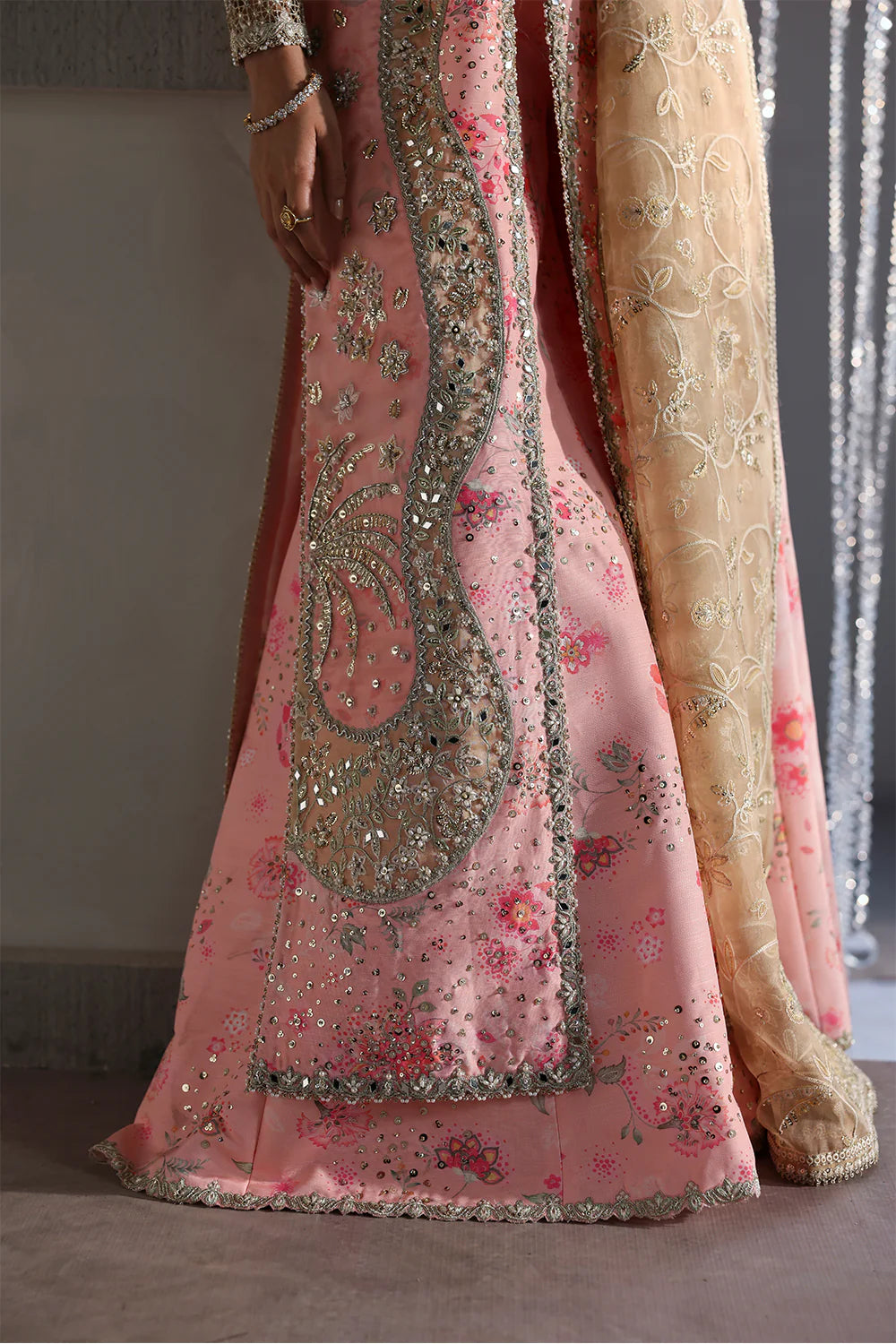 Model wearing Velora by Soraya in soft peach and gold embroidered gown – Pakistani luxury pret for weddings, shop Pakistani clothes online in UK.
