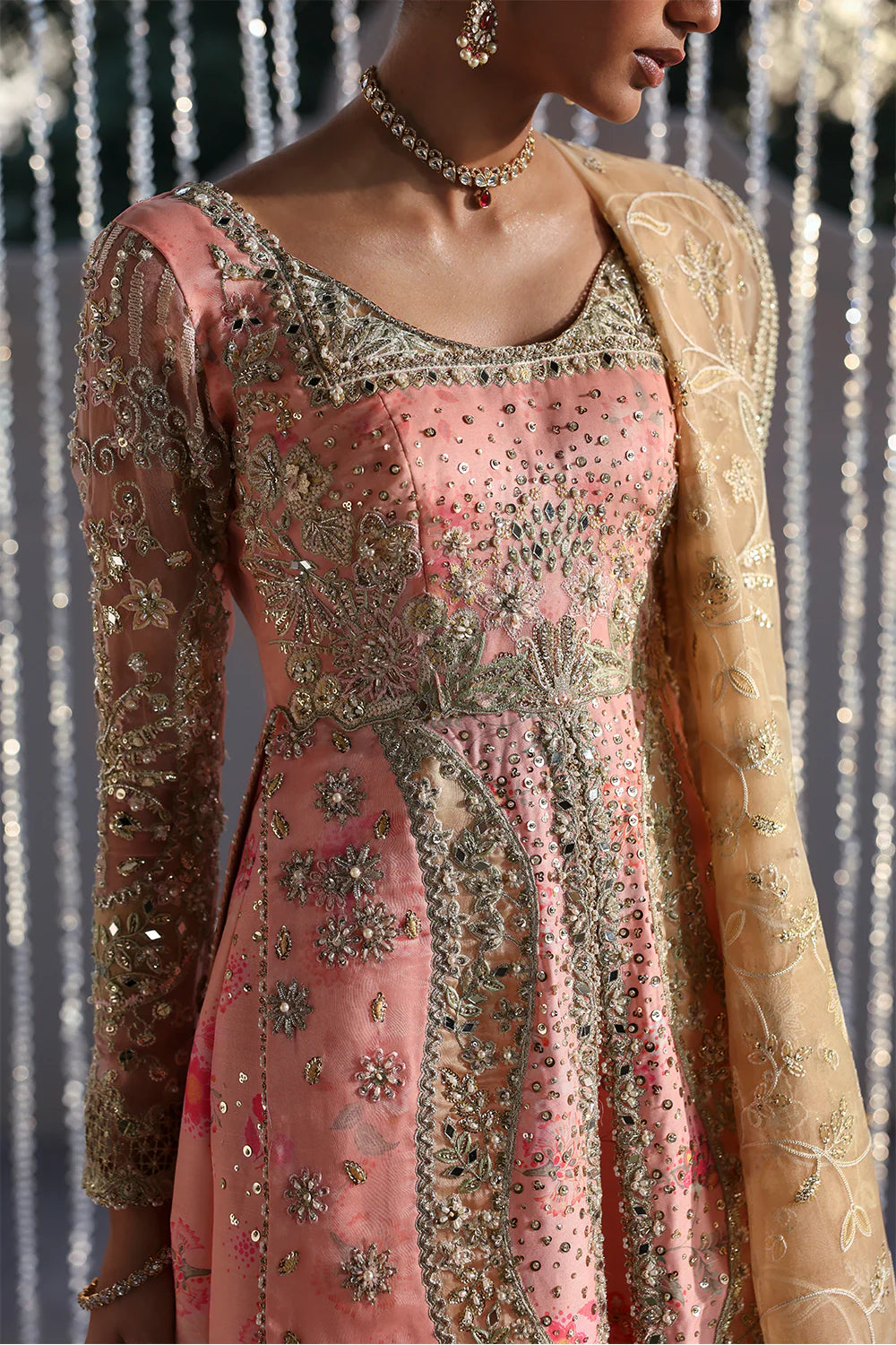 Model wearing Velora by Soraya in soft peach and gold embroidered gown – Pakistani luxury pret for weddings, shop Pakistani clothes online in UK.

