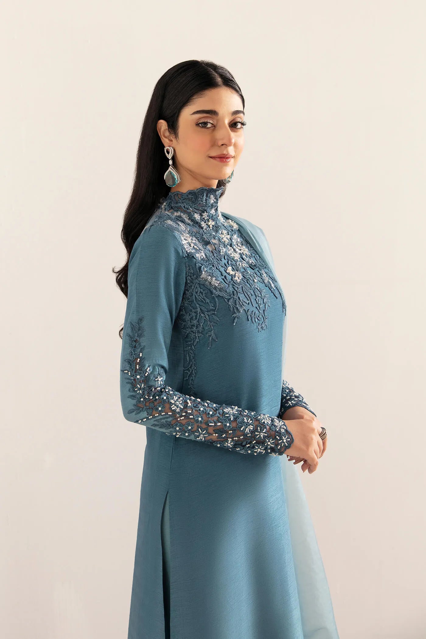 Model wearing VIVA LA VIDA's AQUA ROMANCE, an equisite mold by Musferah Saad UK, Pakistani Clothes UK.