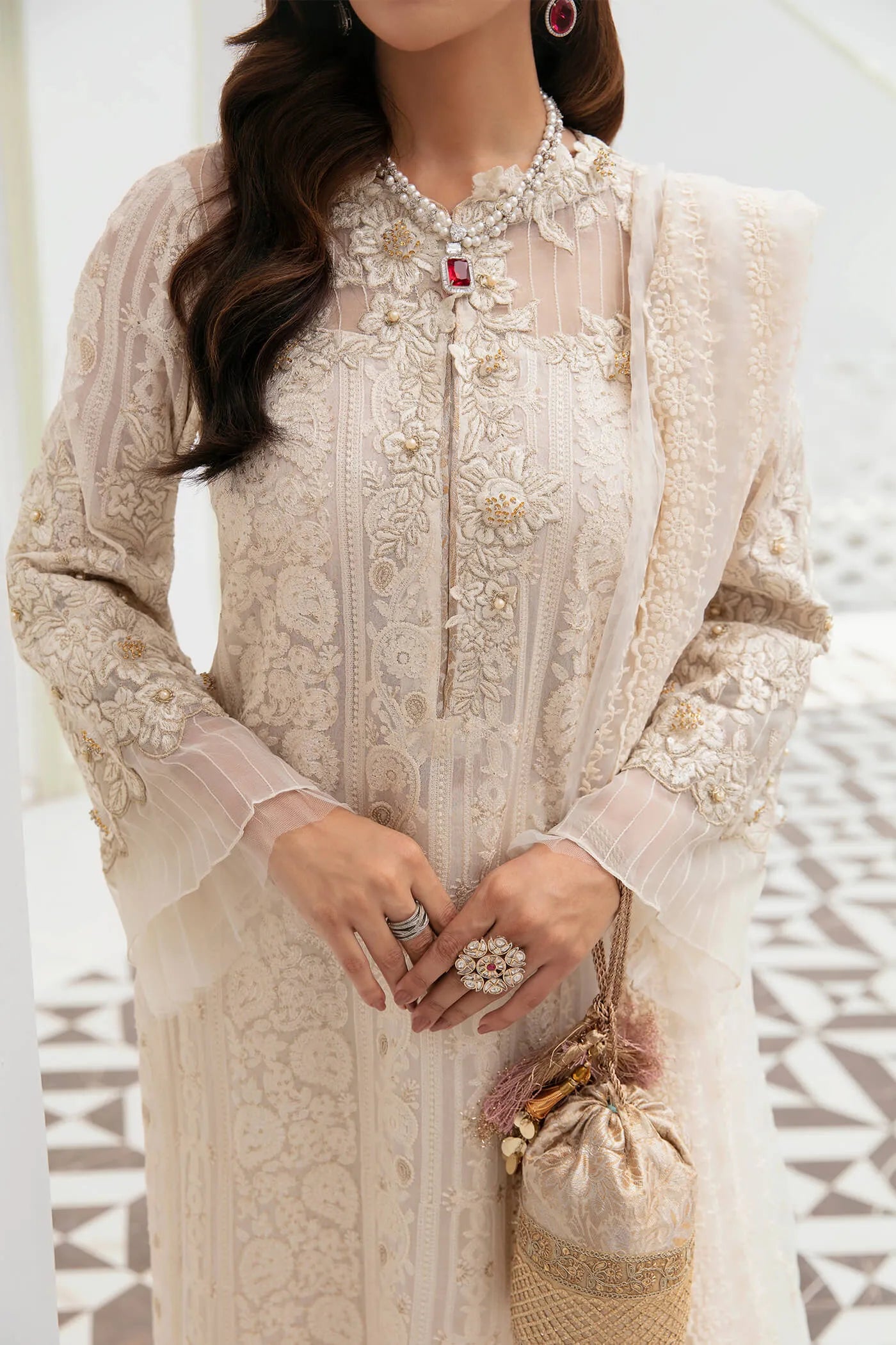 Model wearing VIVA LA VIDA's IVORY SENSATION, an equisite mold by Musferah Saad UK, Pakistani Clothes UK.