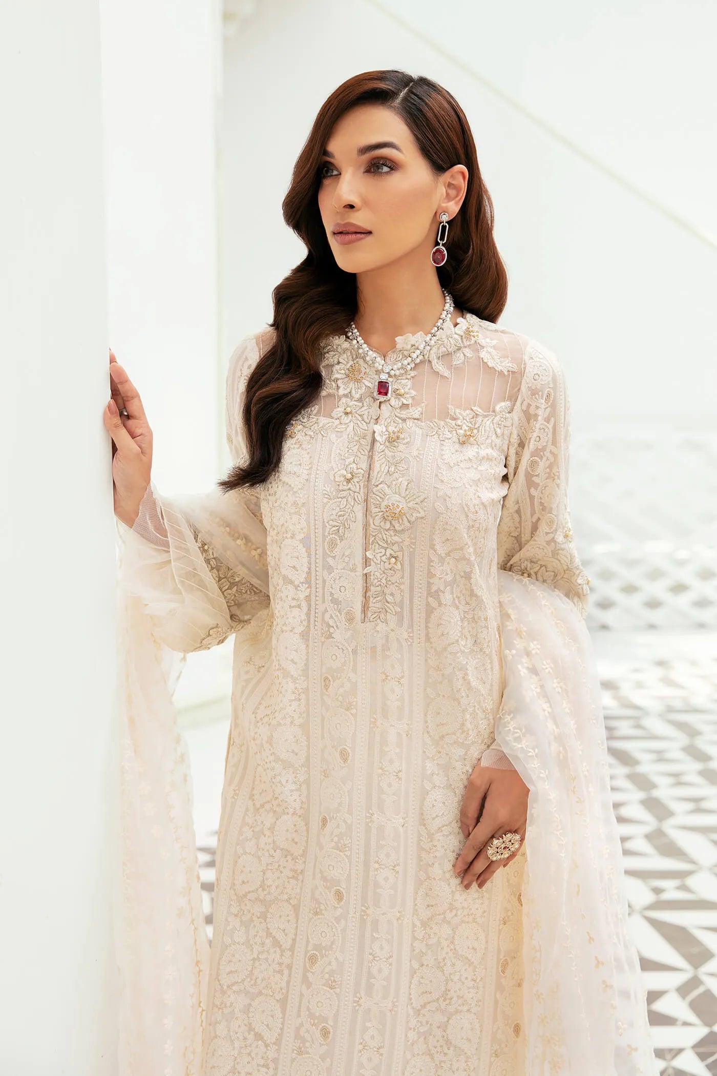 Model wearing VIVA LA VIDA's IVORY SENSATION, an equisite mold by Musferah Saad UK, Pakistani Clothes UK.