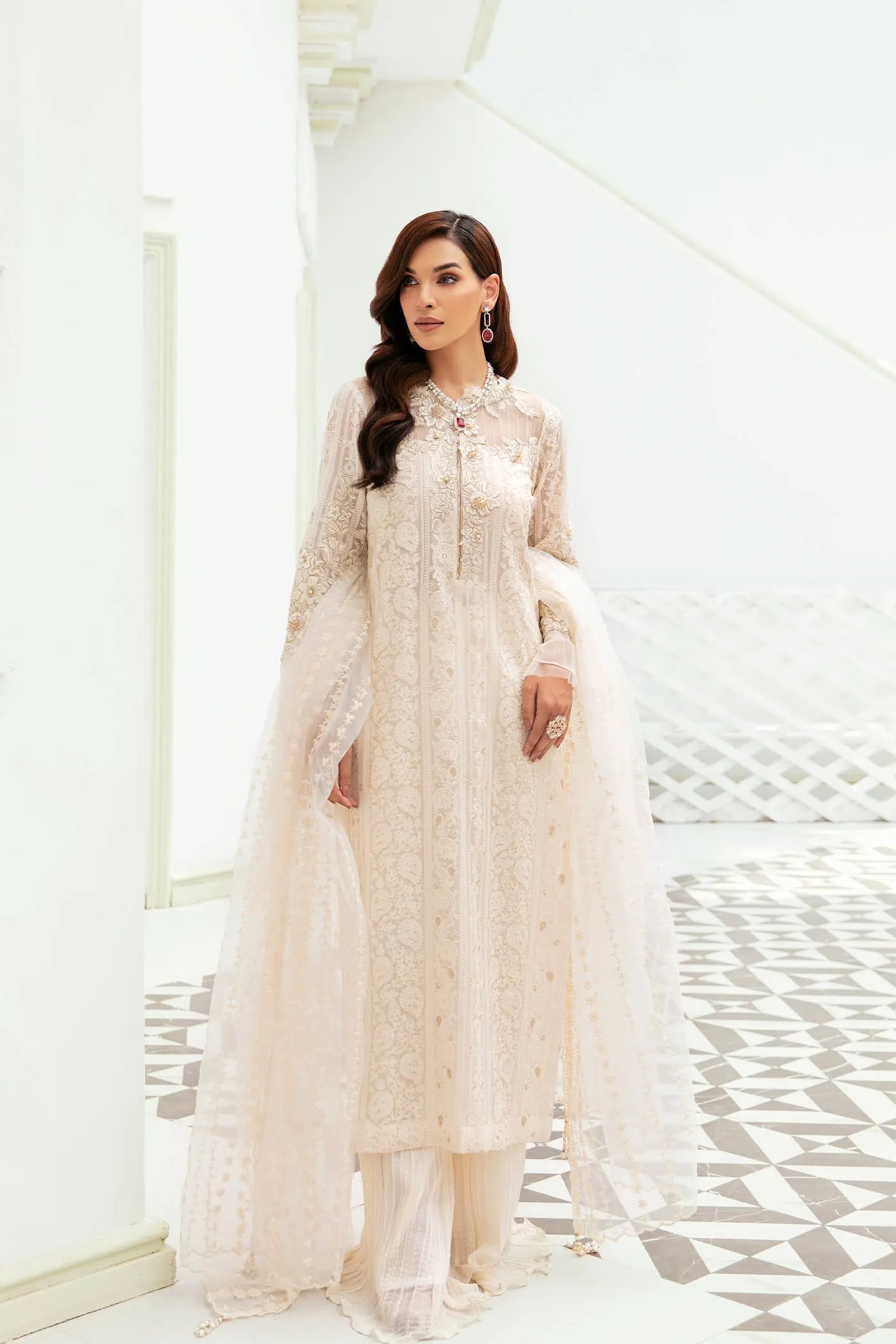 Model wearing VIVA LA VIDA's IVORY SENSATION, an equisite mold by Musferah Saad UK, Pakistani Clothes UK.