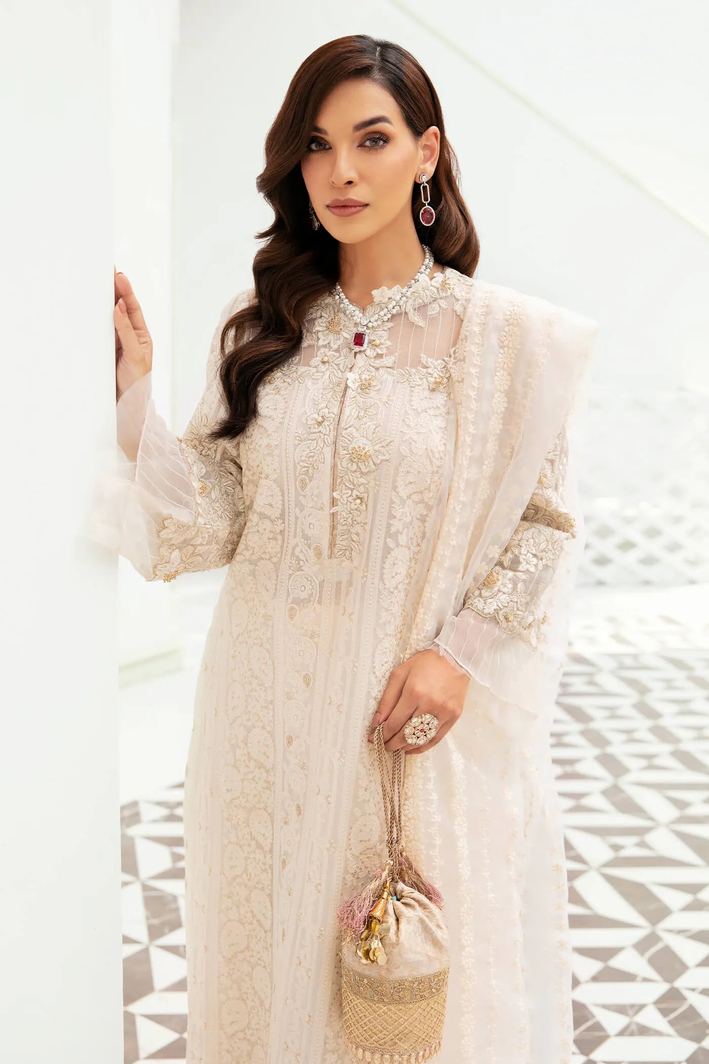 Model wearing VIVA LA VIDA's IVORY SENSATION, an equisite mold by Musferah Saad UK, Pakistani Clothes UK.