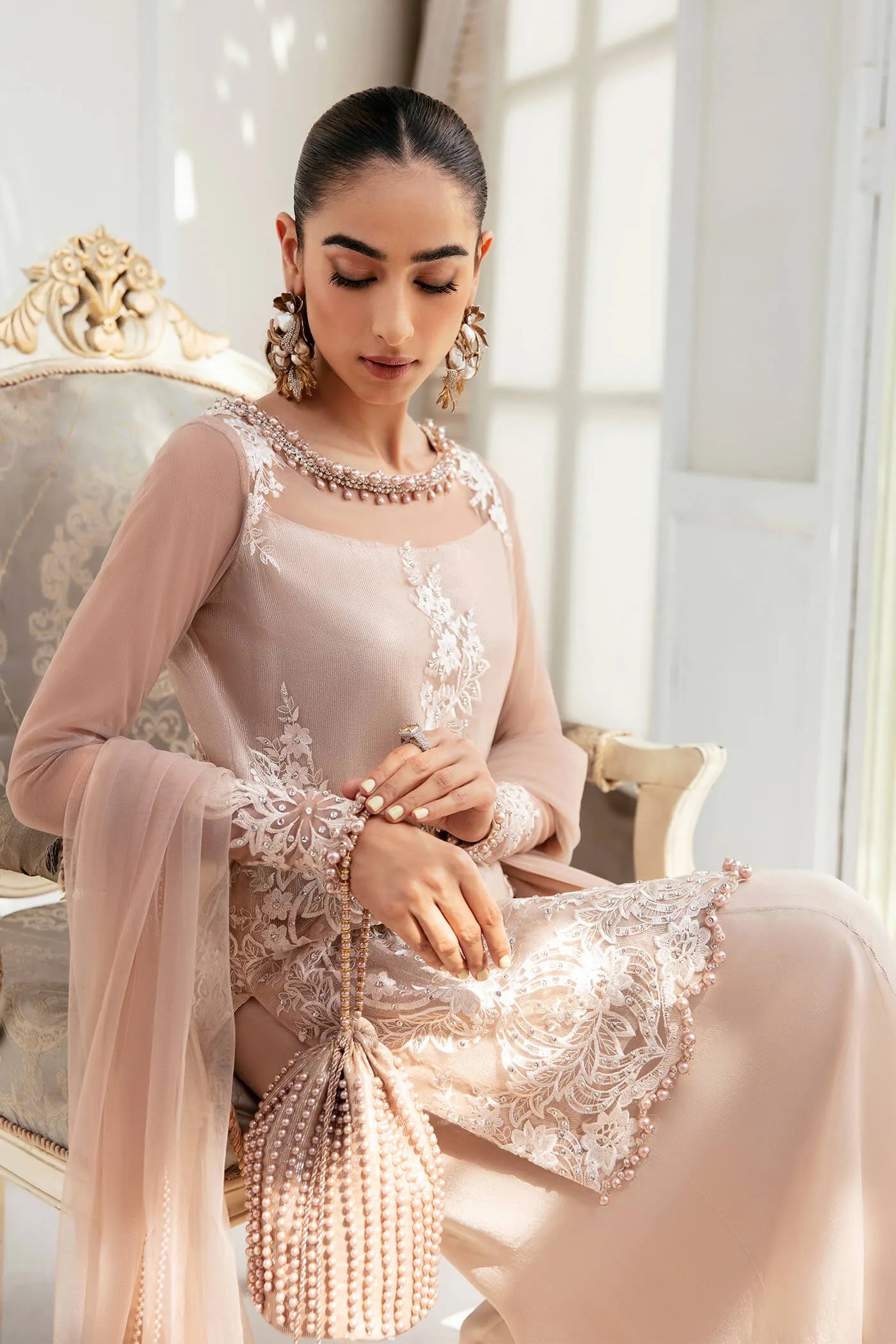 Model wearing VIVA LA VIDA's SUNLIT SERENADE, an equisite mold by Musferah Saad UK, Pakistani Clothes UK.