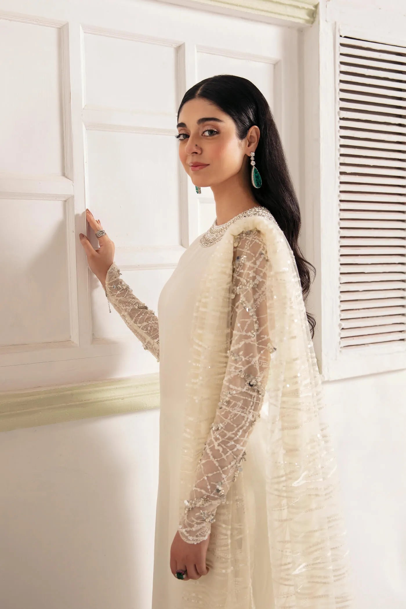 Model wearing VIVA LA VIDA's WHITE DAHLIA, an equisite mold by Musferah Saad UK, Pakistani Clothes UK.