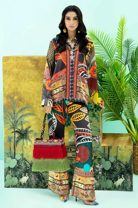 Model wearing colorful Wildflower dress from Musferah Saad's Resort collection '24, showcasing Pakistani clothes online in the UK.