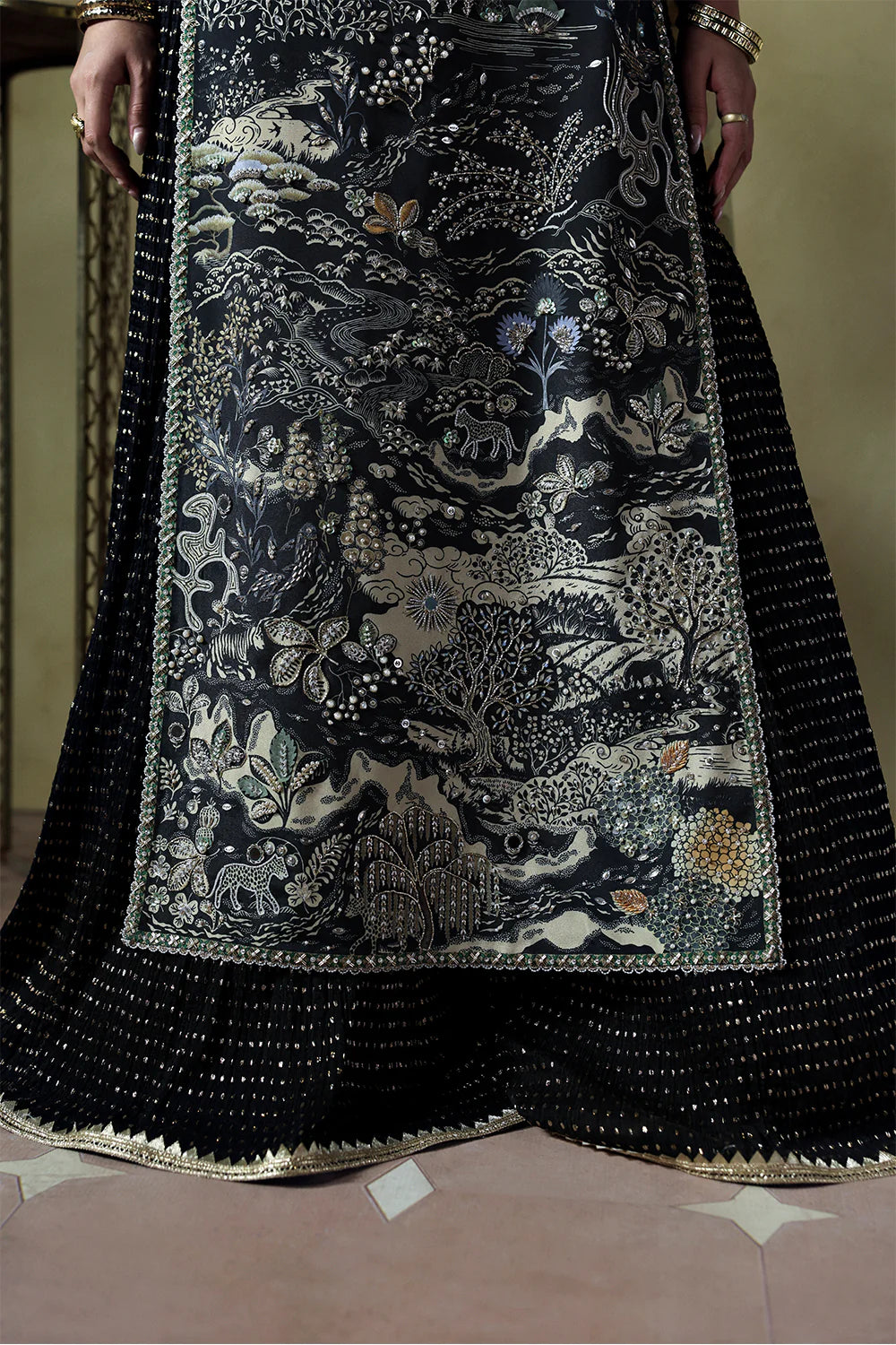 Model wearing Zyra by Soraya in deep black with intricate silver embroidery – Pakistani luxury pret, shop Pakistani clothes online in UK.
