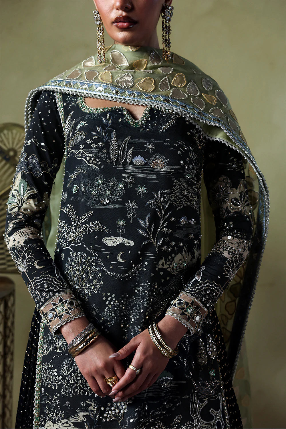 Model wearing Zyra by Soraya in deep black with intricate silver embroidery – Pakistani luxury pret, shop Pakistani clothes online in UK.
