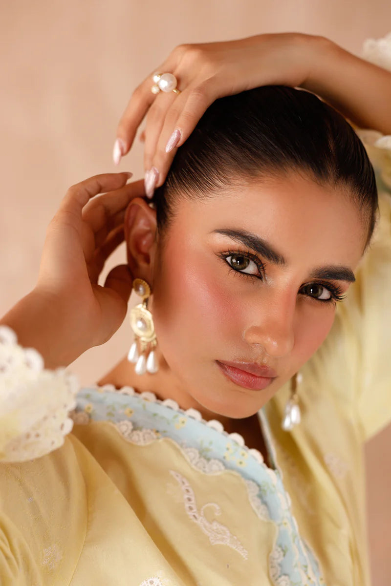 Model wearing yellow embroidered coords EP-10 Elin from Qalamkar, Pakistani luxury pret available online in UK.