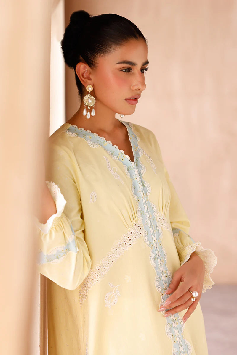 Model wearing yellow embroidered coords EP-10 Elin from Qalamkar, Pakistani luxury pret available online in UK.