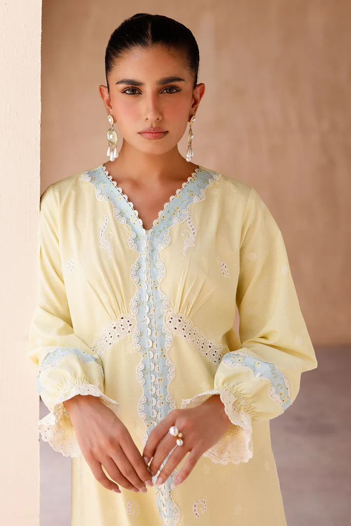 Model wearing yellow embroidered coords EP-10 Elin from Qalamkar, Pakistani luxury pret available online in UK.