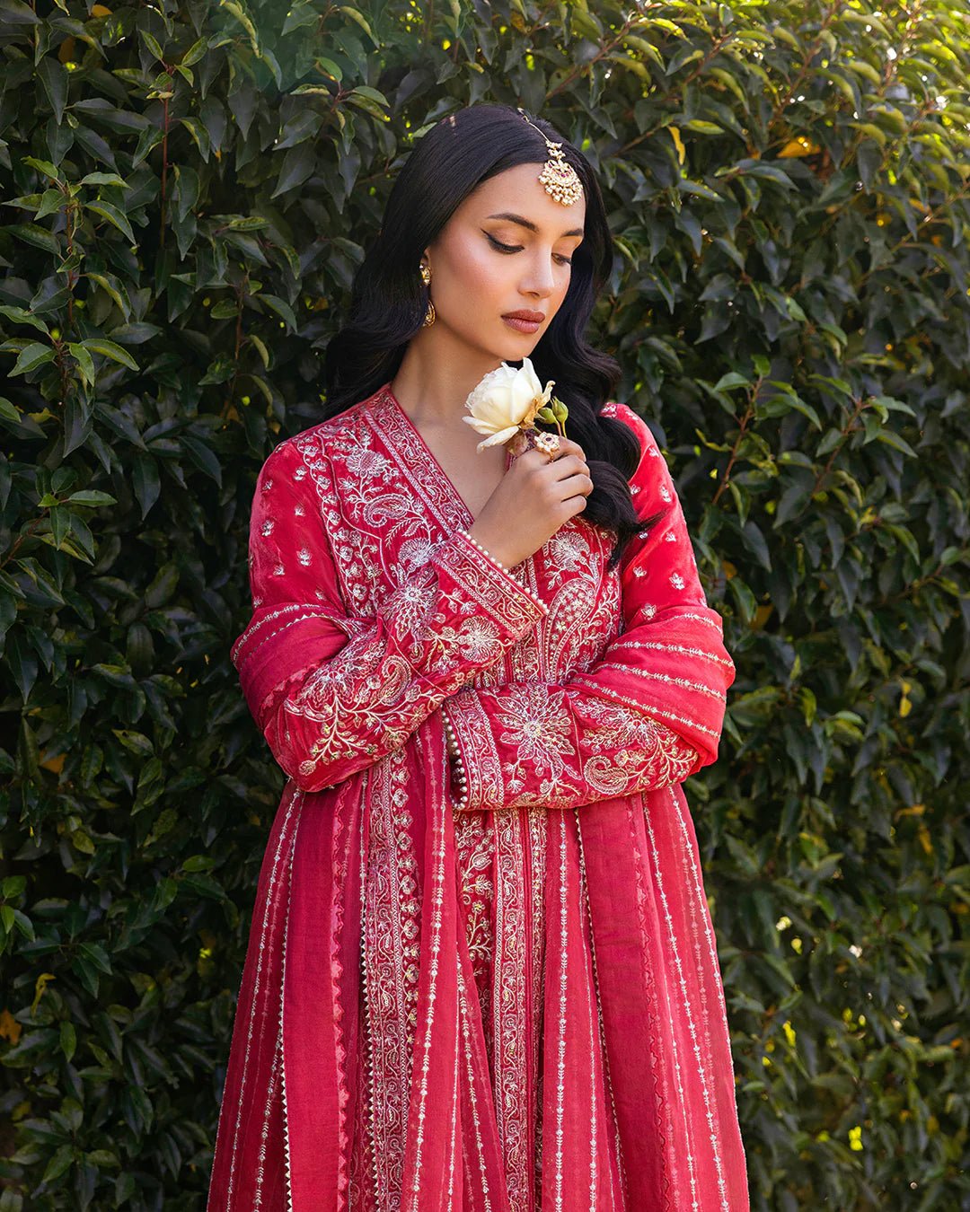 Model wearing Alannah from Faiza Saqlain's Adeen Velvet '24 collection in rich maroon. Luxury pret, festive, Pakistani clothes online in UK.