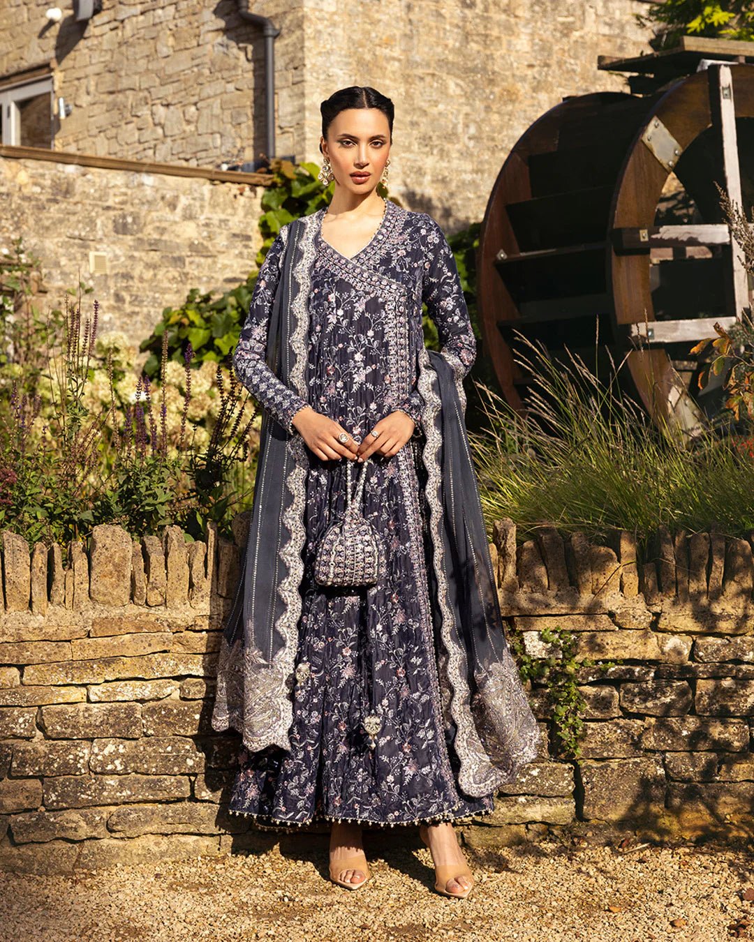 Model wearing Darcel from Faiza Saqlain's Adeen Velvet '24 collection in rich navy blue. Luxury pret, festive, Pakistani clothes online in UK.