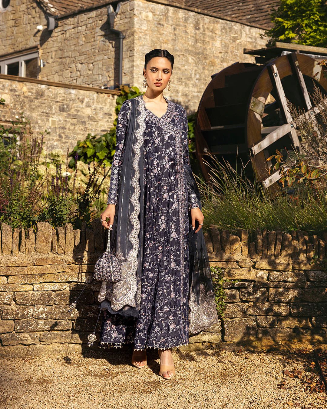 Model wearing Darcel from Faiza Saqlain's Adeen Velvet '24 collection in rich navy blue. Luxury pret, festive, Pakistani clothes online in UK.