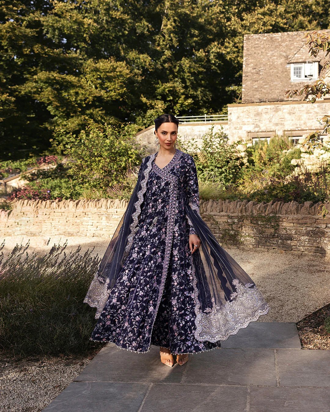 Model wearing Darcel from Faiza Saqlain's Adeen Velvet '24 collection in rich navy blue. Luxury pret, festive, Pakistani clothes online in UK.