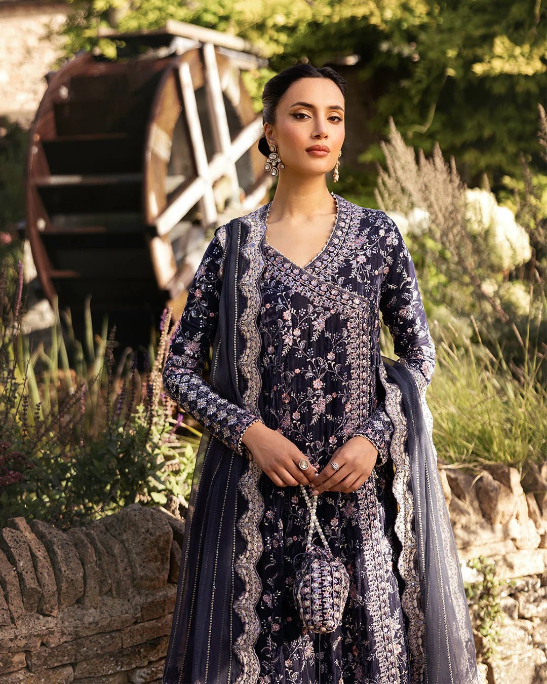 Model wearing Darcel from Faiza Saqlain's Adeen Velvet '24 collection in rich navy blue. Luxury pret, festive, Pakistani clothes online in UK.