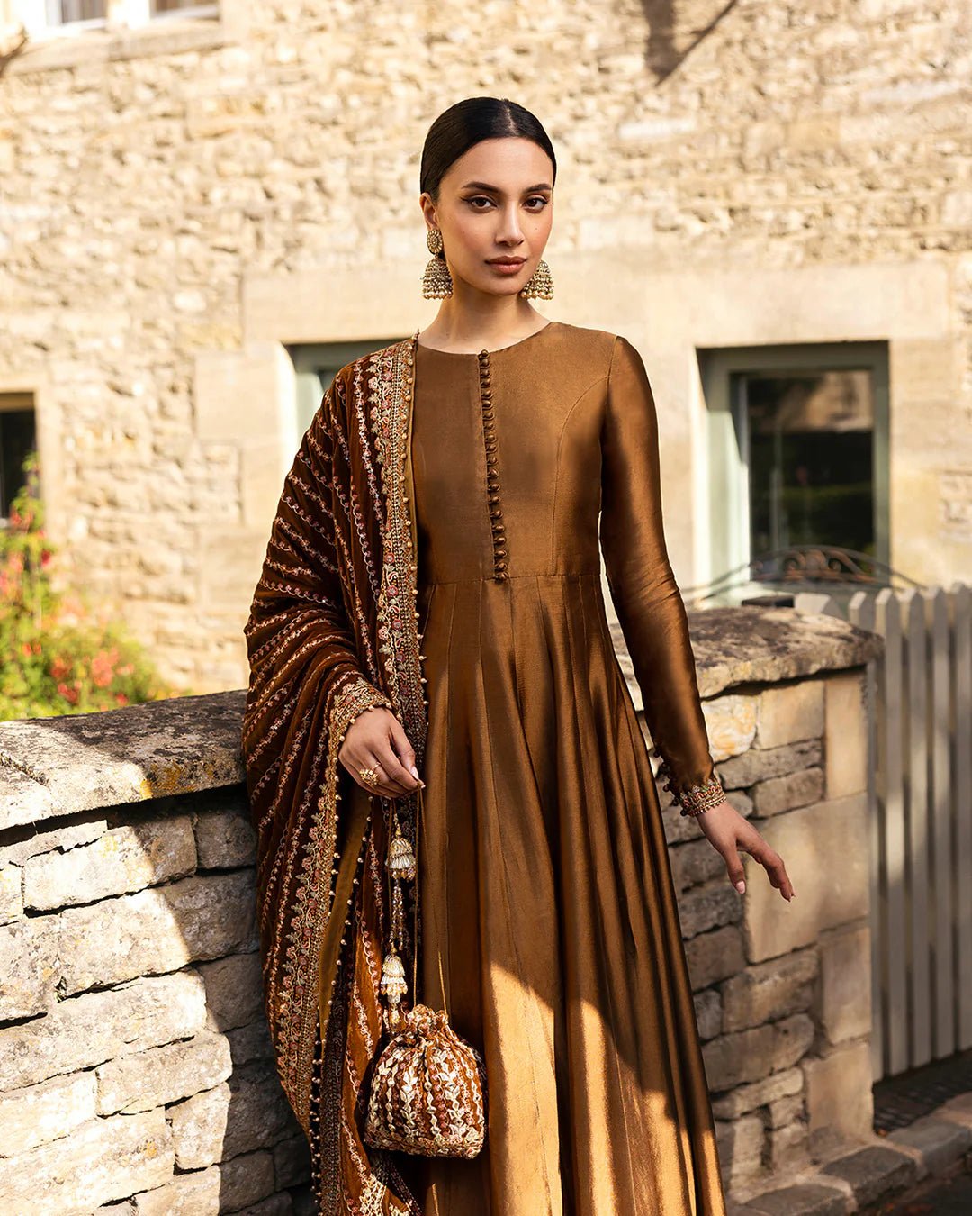 Model wearing Emera from Faiza Saqlain's Adeen Velvet '24 collection in deep emerald green. Luxury pret, festive, Pakistani clothes online in UK.