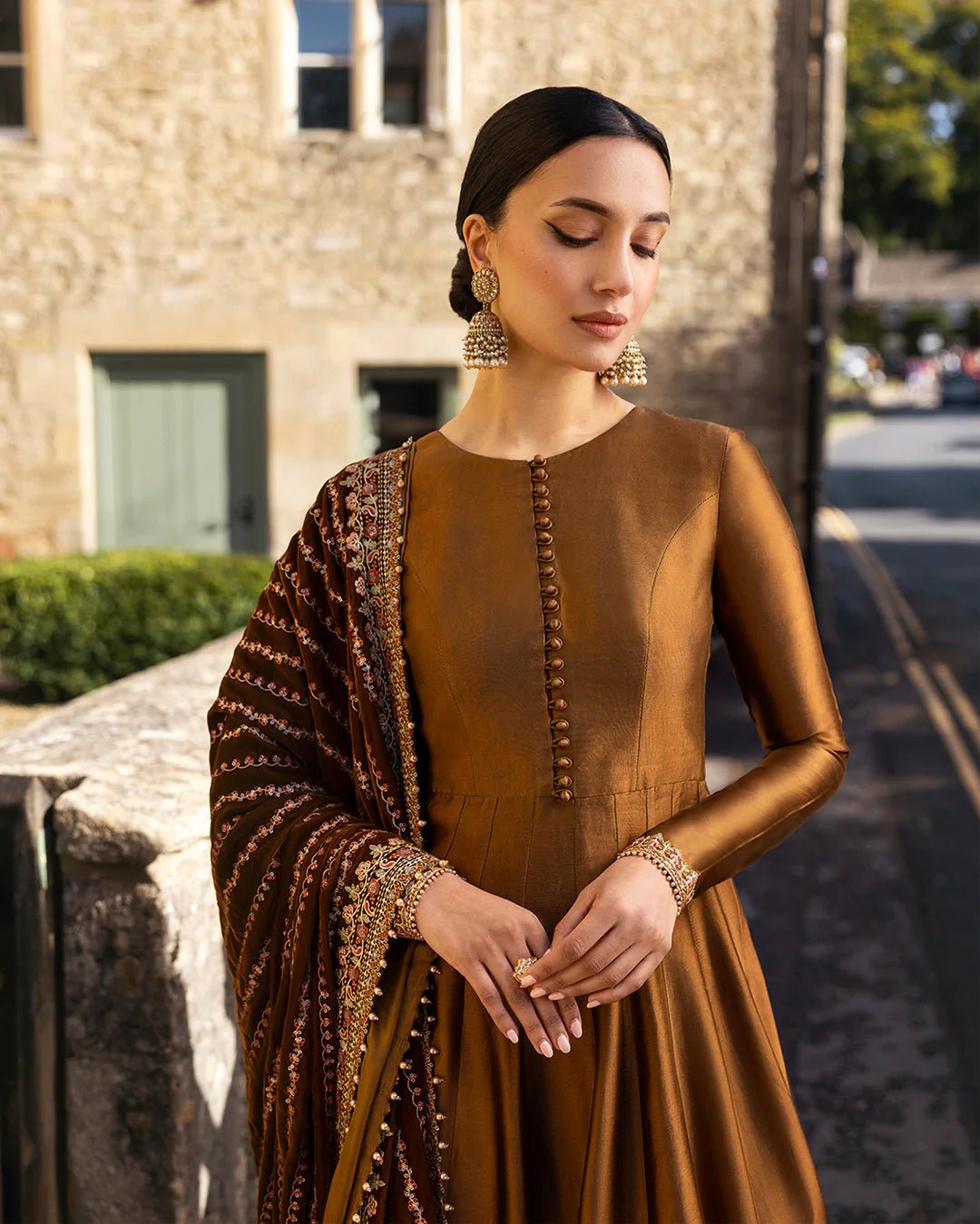 Model wearing Emera from Faiza Saqlain's Adeen Velvet '24 collection in deep emerald green. Luxury pret, festive, Pakistani clothes online in UK.