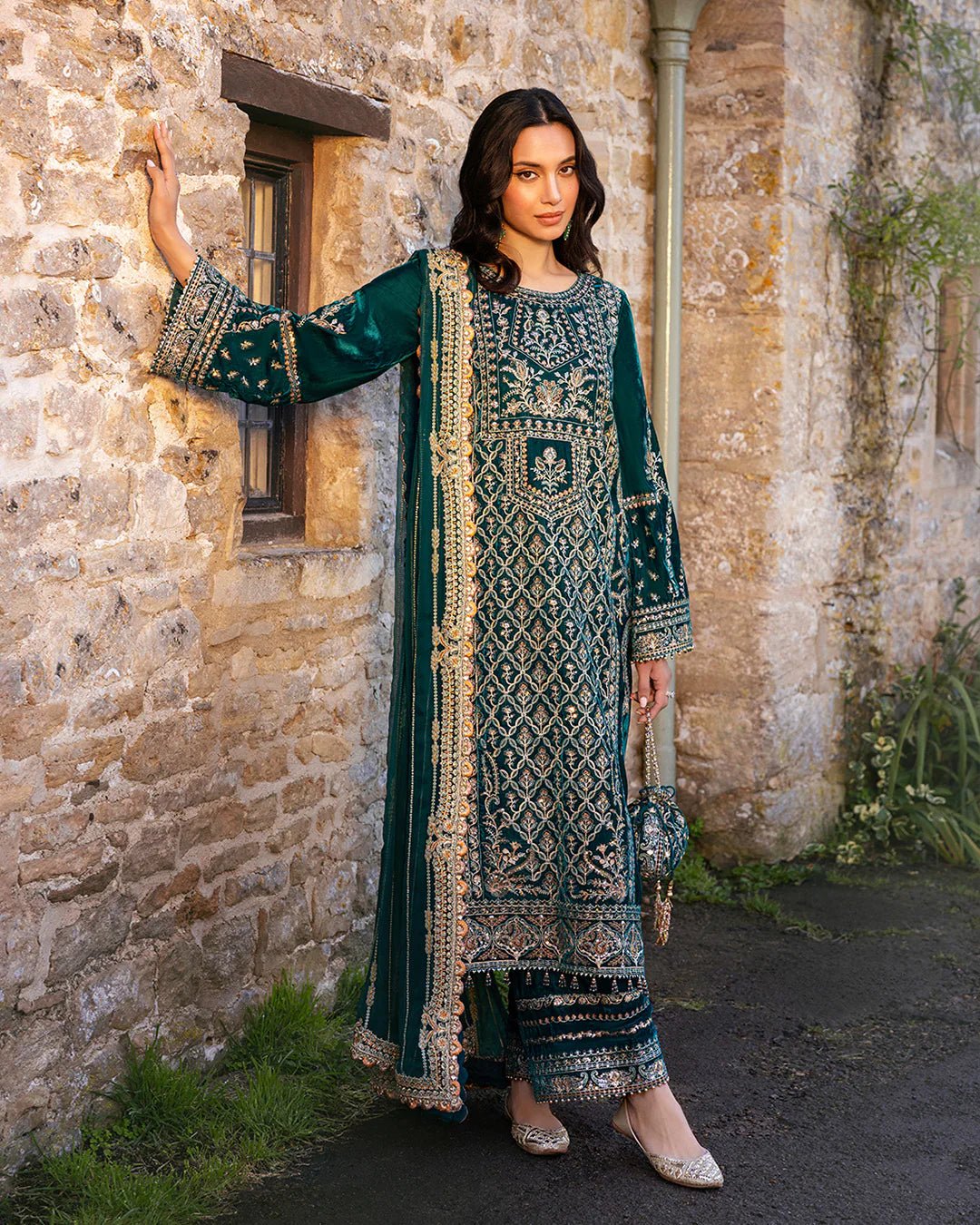 Model wearing Merna from Faiza Saqlain's Adeen Velvet '24 collection in teal green. Luxury pret, festive, Pakistani clothes online in UK.