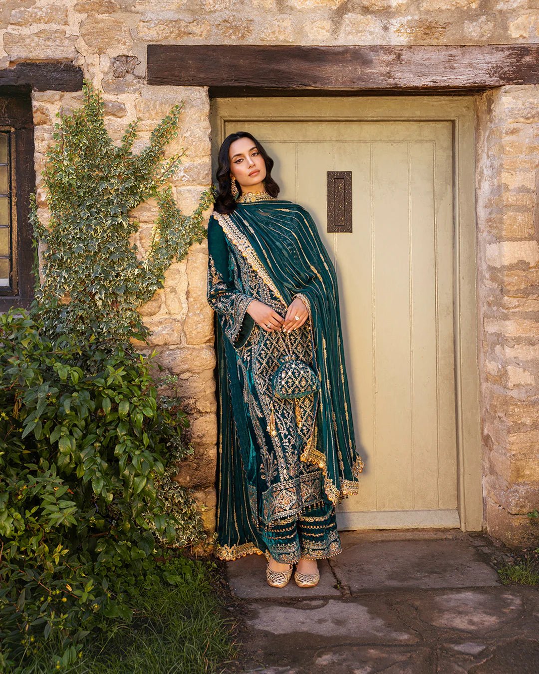 Model wearing Merna from Faiza Saqlain's Adeen Velvet '24 collection in teal green. Luxury pret, festive, Pakistani clothes online in UK.