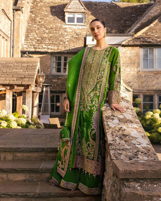 Model wearing Tegan from Faiza Saqlain's Adeen Velvet '24 collection in opulent emerald green. Luxury pret, festive, Pakistani clothes online in UK.