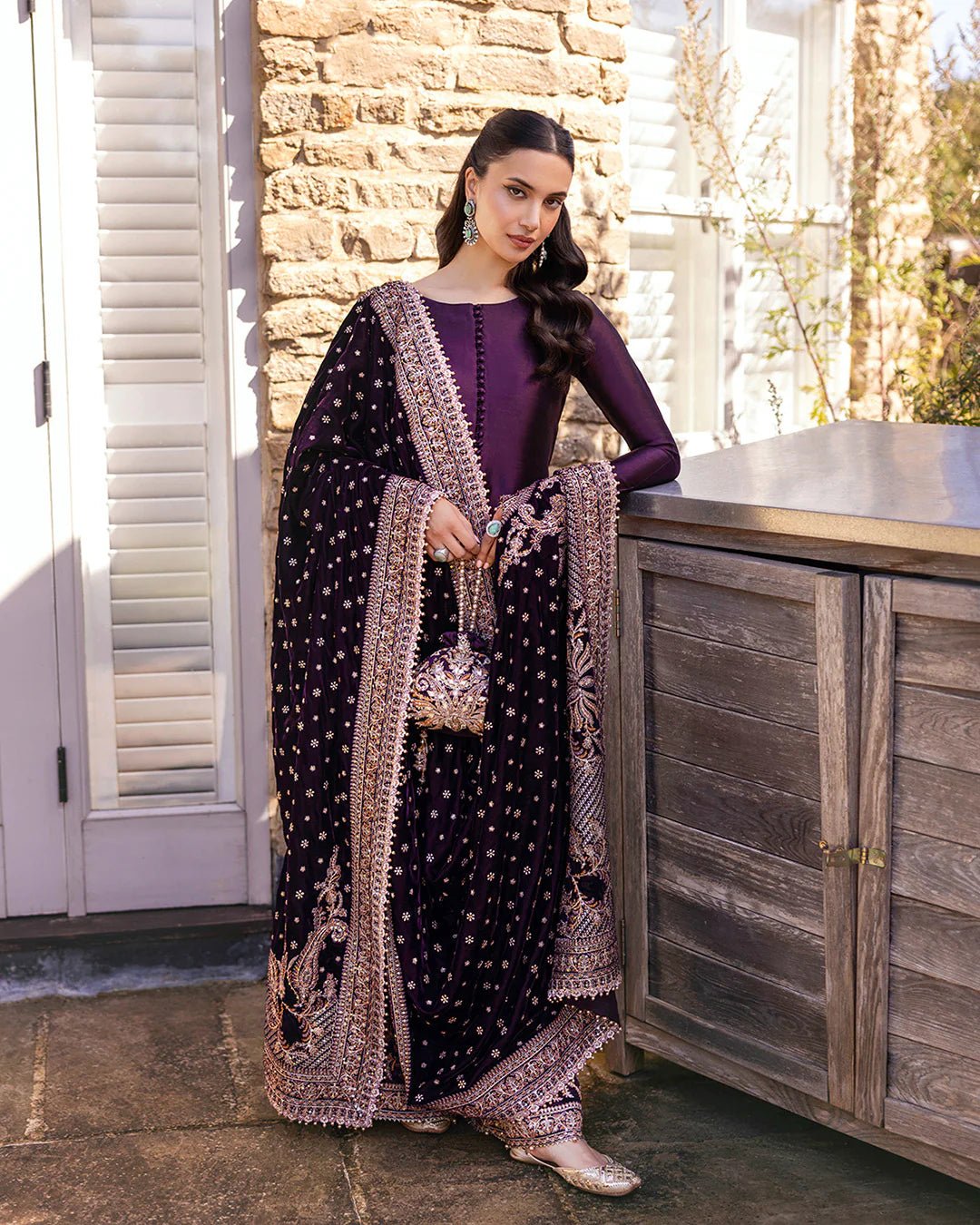 Model wearing Vespera from Faiza Saqlain's Adeen Velvet '24 collection in rich navy blue. Luxury pret, festive, Pakistani clothes online in UK.