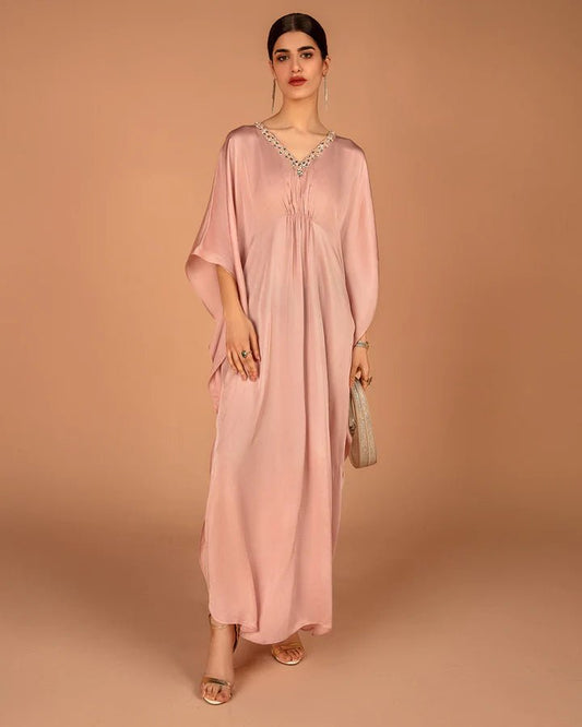 Model wearing a pink Derifa dress from Faiza Saqlain's Aleira Evening Edit '24 collection. Pakistani clothes online in UK.