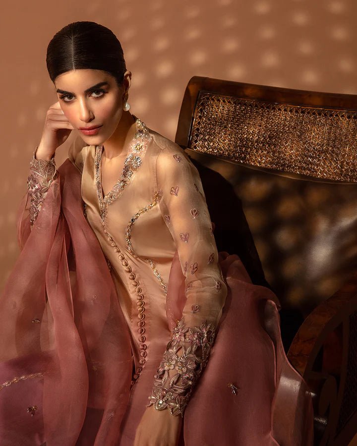 Model wearing a purple Eshe dress from Faiza Saqlain's Aleira Evening Edit '24 collection. Pakistani clothes online in UK.