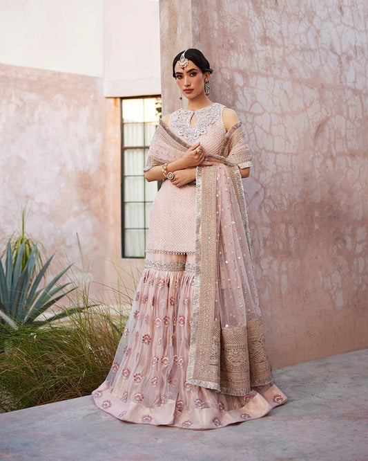 Model wearing a pink Eilees dress from Faiza Saqlain's Lenora Luxury Pret '24 collection. Pakistani clothes online in UK.