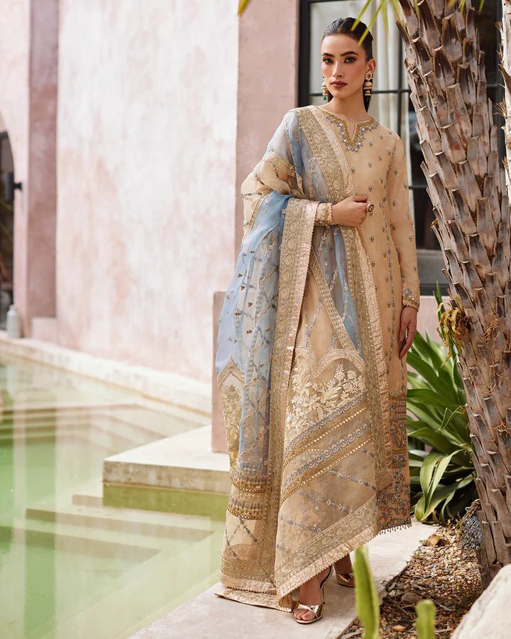 Model wearing a beige and blue Yelena dress from Faiza Saqlain's Lenora Luxury Pret '24 collection. Pakistani clothes online in UK.