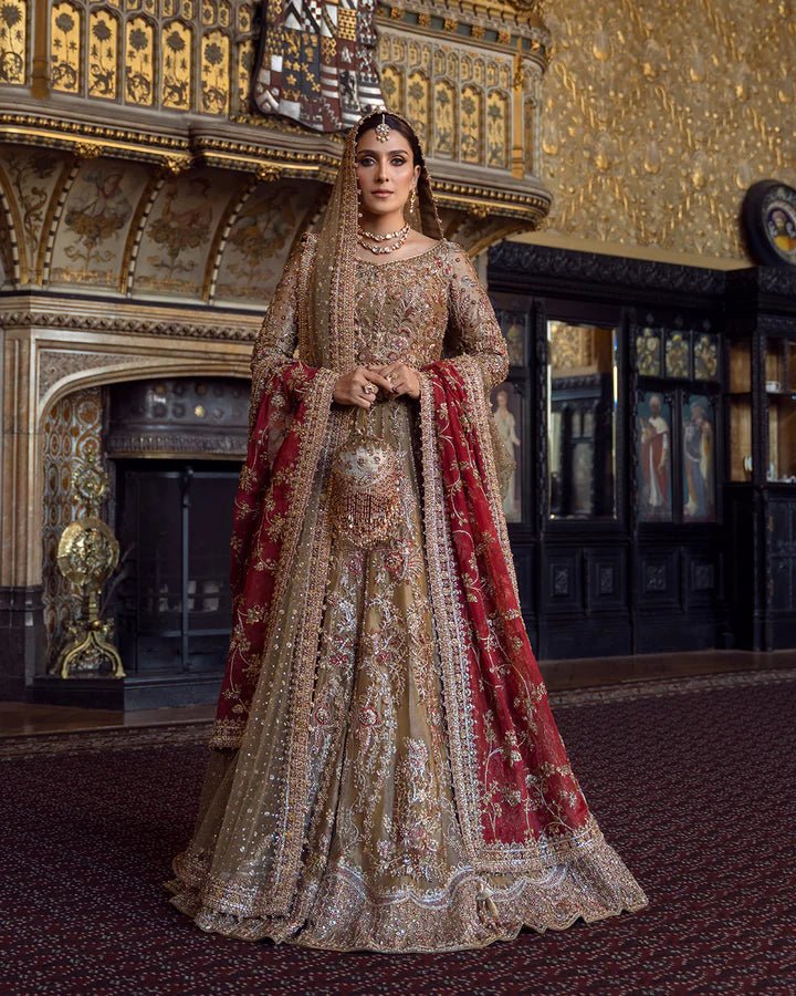 Model wearing a red and gold Ghina bridal dress by Faiza Saqlain featuring intricate embroidery, ideal for Pakistani weddings, available online in the UK.