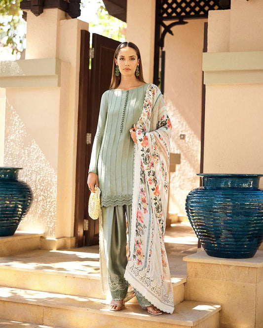 Model wearing Faiza Saqlain Carmela Arnett dress in sage green with a floral printed white dupatta. Shop Pakistani bridal dresses online in the UK now.