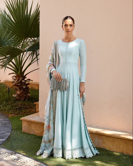 Model wearing a sky blue Latissa dress from Faiza Saqlain, featuring delicate embroidery. Ideal for showcasing Pakistani clothes in the UK at Signature Labels