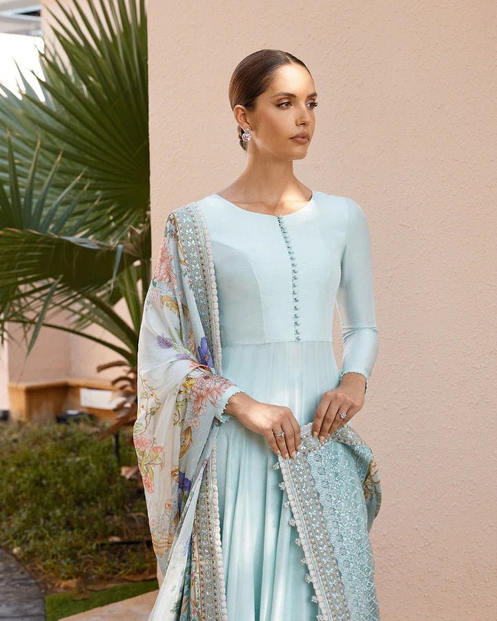 Model wearing a sky blue Latissa dress from Faiza Saqlain, featuring delicate embroidery. Ideal for showcasing Pakistani clothes in the UK at Signature Labels