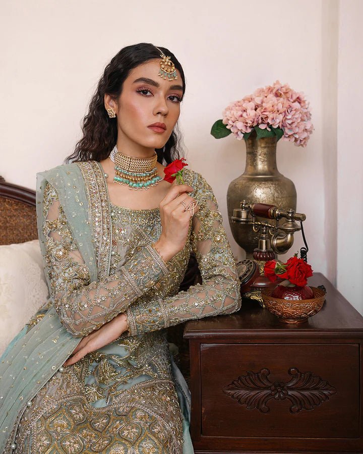 Model wearing Faiza Saqlain Formals Irina Oct '23 Cahya dress in ice - blue, showcasing Pakistani clothes online in UK.