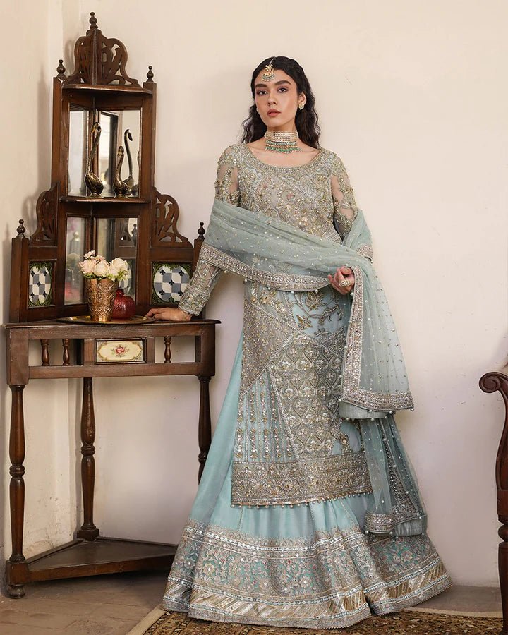 Model wearing Faiza Saqlain Formals Irina Oct '23 Cahya dress in ice - blue, showcasing Pakistani clothes online in UK.