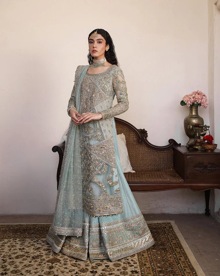 Model wearing Faiza Saqlain Formals Irina Oct '23 Cahya dress in ice - blue, showcasing Pakistani clothes online in UK.