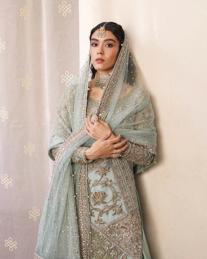 Model wearing Faiza Saqlain Formals Irina Oct '23 Cahya dress in ice - blue, showcasing Pakistani clothes online in UK.