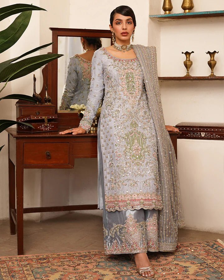 Model wearing Faiza Saqlain Formals Irina Oct '23 Edrina dress in grayish blue, Pakistani clothes online in UK.